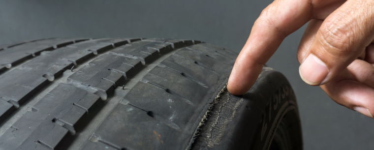 Checking a tyre with a thin outer tread