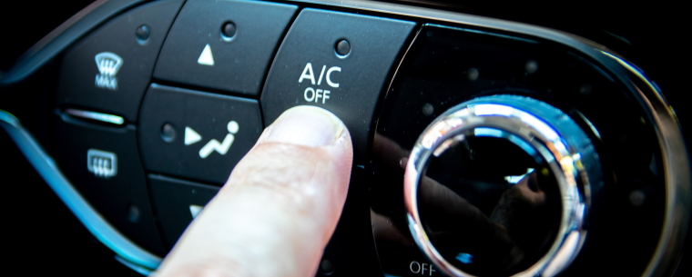 Person pressing an air con button