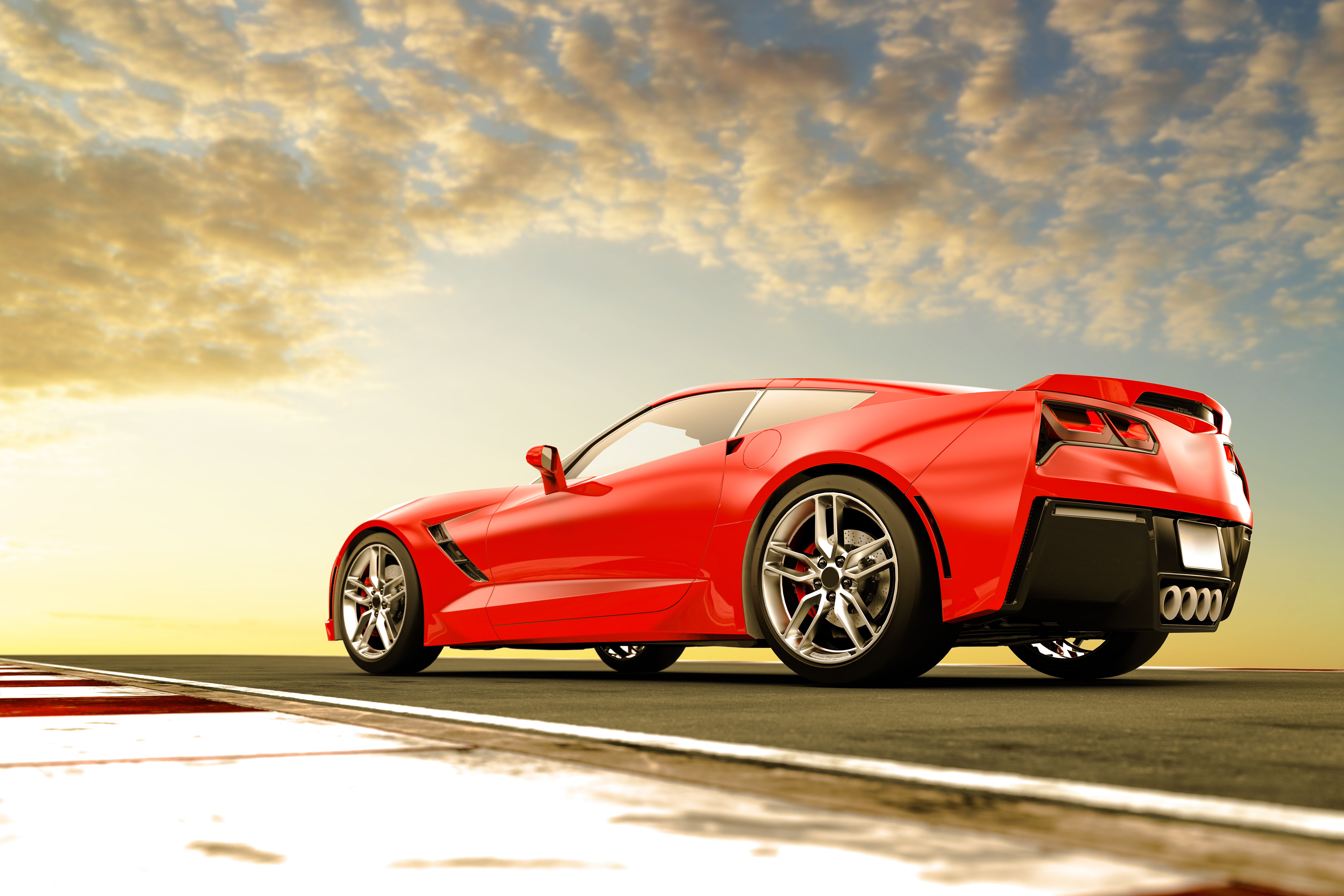 A sleek red sports car on a race track.