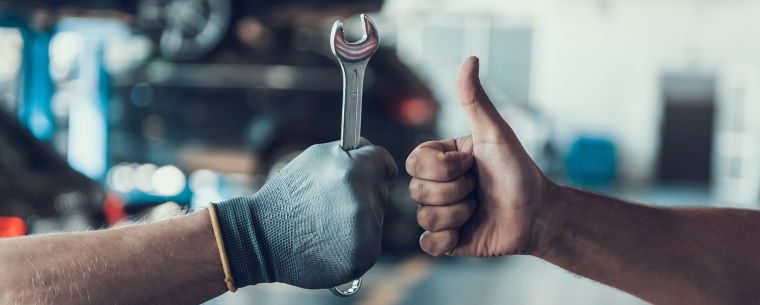 Thumbs up after a successful car service