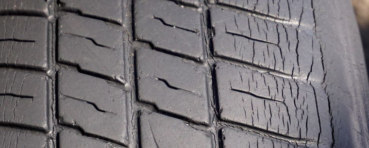 Close up shot of an old cracked tyre