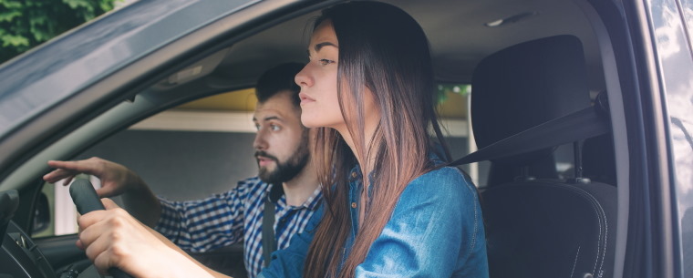 A learner driving taking her test