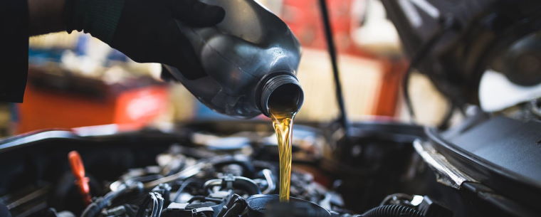 Technician Filling Up Engine Oil