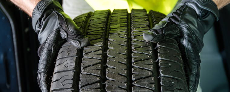 Technician Inspecting a New Tyre 