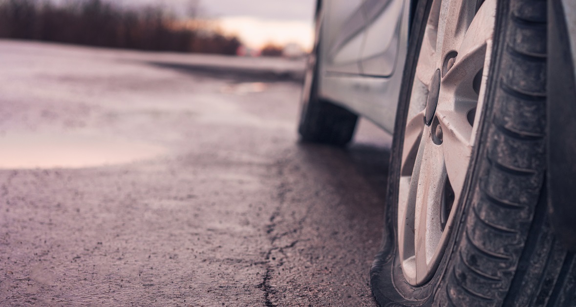 Car with deflated tyre