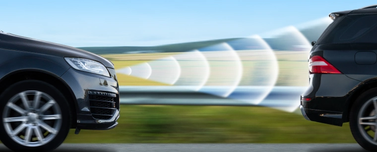Creative graphic of a car following another car showing the range of adaptive cruise control.